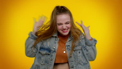 teen girl in denim jacket demonstrating tongue out, fooling around, making silly faces, madness