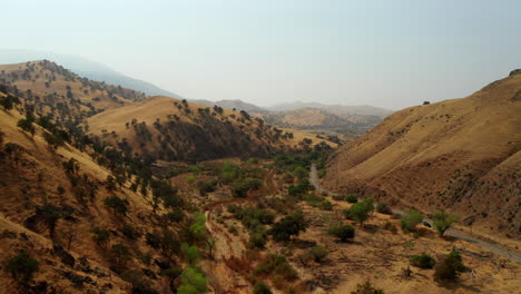 Drone-flight-over-a-dry-canyon-in-Southern-California-during-a-drought-year-with-wildfire-warning