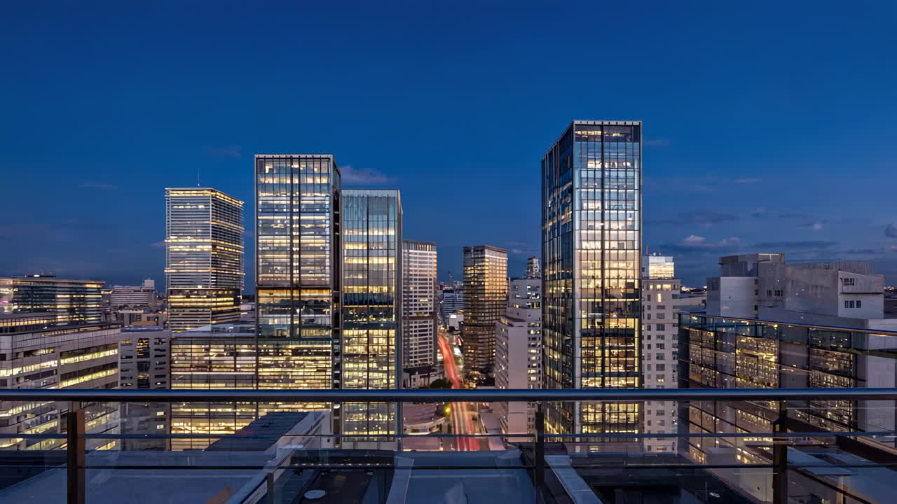 Nighttime cityscape with illuminated skyscrapers and light trails