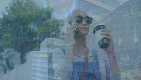 Animation-of-graphs,-trading-board,-caucasian-bald-woman-drinking-coffee-and-talking-on-phone