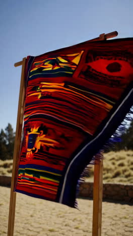 vibrant handwoven textile displayed outdoors