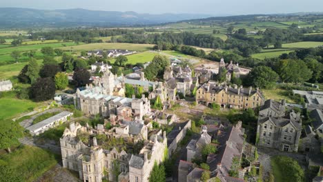 haunted denbigh lunatic asylum, north wales, aerial anticlockwise rotate from far, sunny afternoon