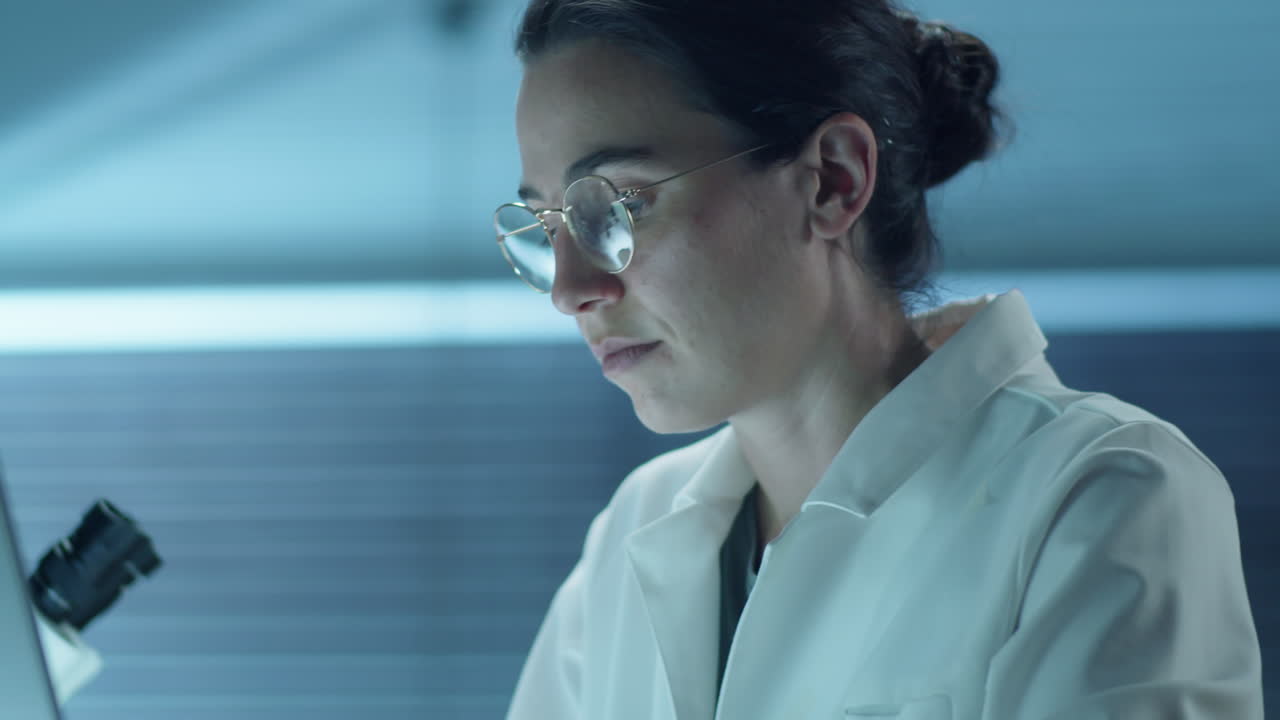 Female Scientist Working on Laptop in Laboratory