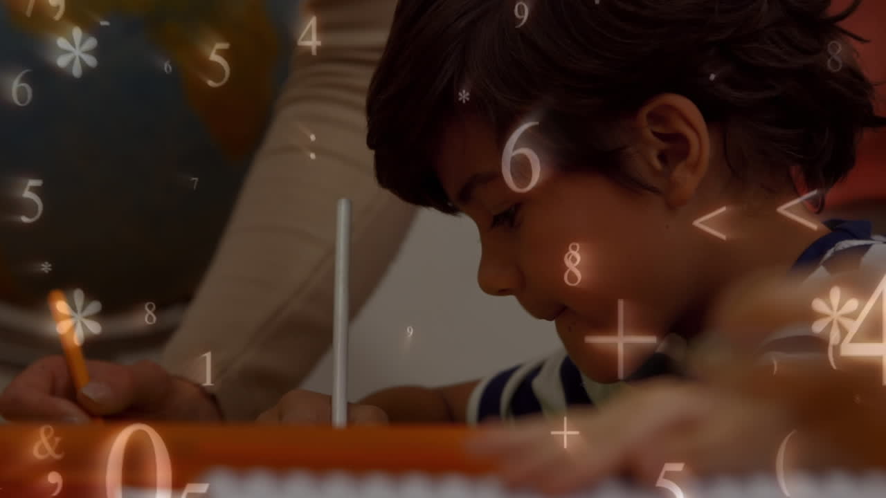 Young boy writing in the classroom