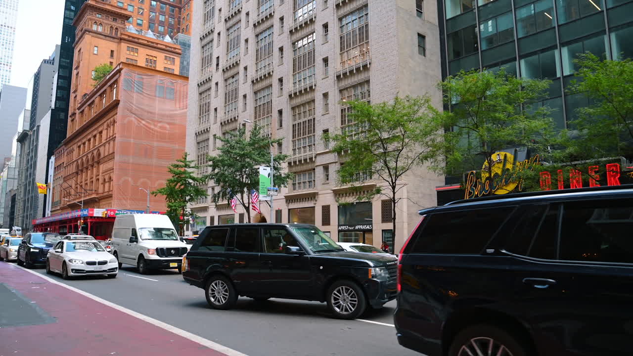 Cadillac SUV in traffic near Brooklyn Diner Manhattan
