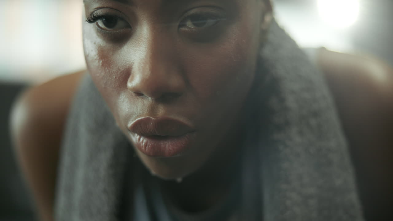 Close-up portrait of a sweaty woman after a workout