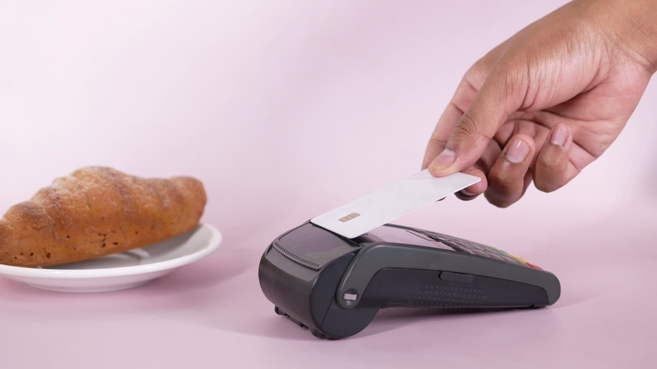 contactless payment concept with young man paying with credit card