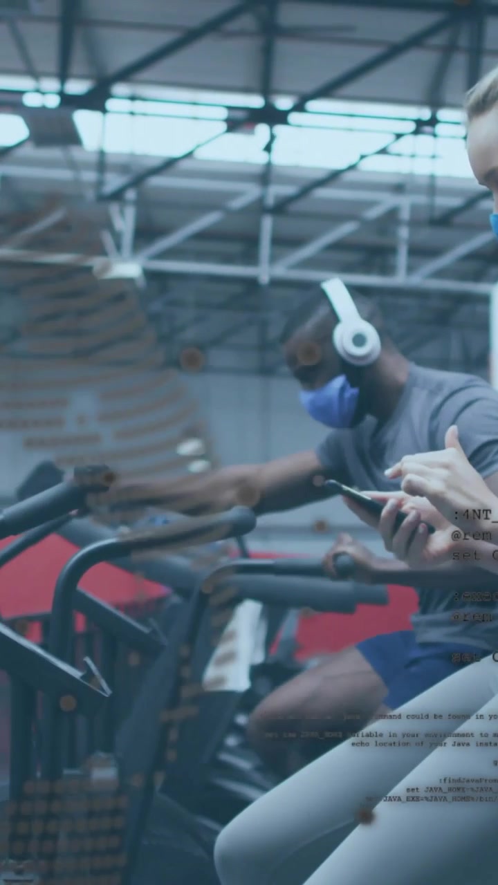 Vertical video: Dotted overlay moving, covering left, man cycling, woman tapping phone for fitness