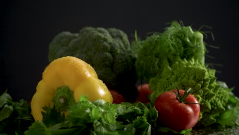 water droplets splashing on fresh colorful vegetables, slow motion studioshot