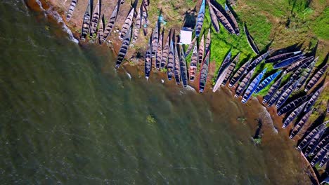 Aerial-View-Of-Illegal-Fishing-Boats-Confiscated-By-Police-On-The-Shores-Of-Lake-Victoria,-Tanzania