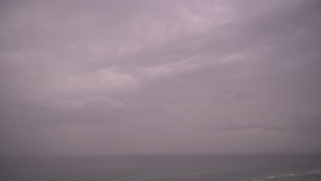 clouds change over the gulf of mexico coastline in a timelapse