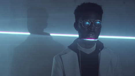 Young-Black-Man-Posing-in-Dark-Studio-with-Laser-Light