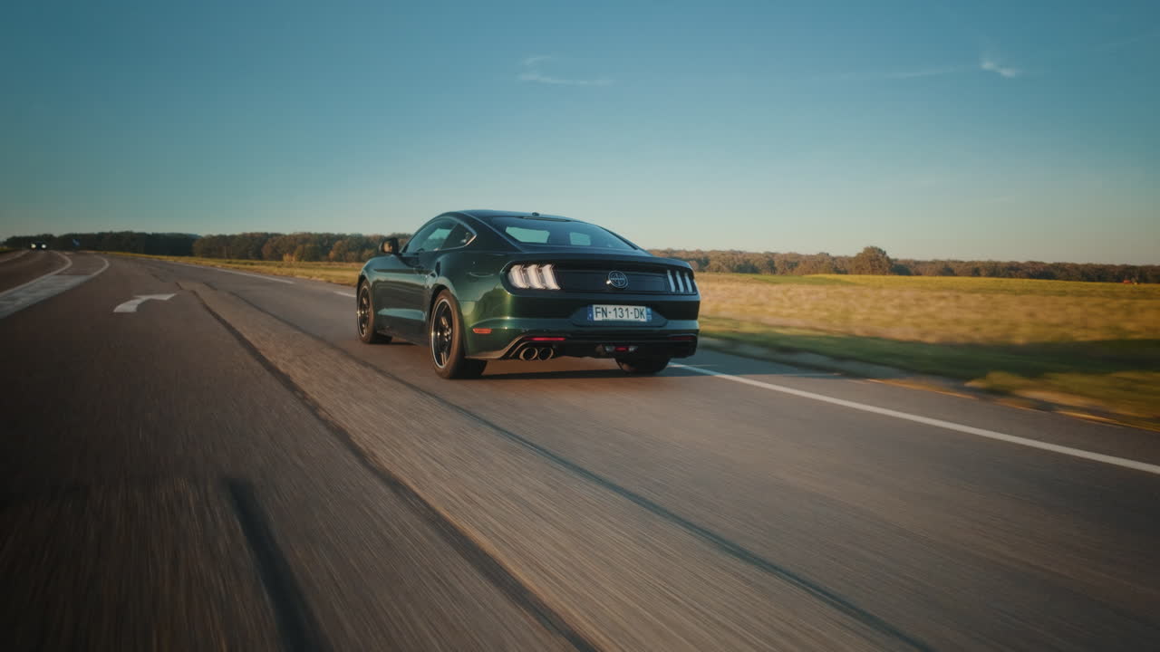 Green Sports Car on a Scenic Road