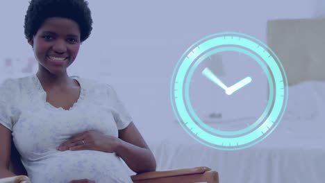 clock with fast moving hands over happy pregnant african american woman sitting and holding belly