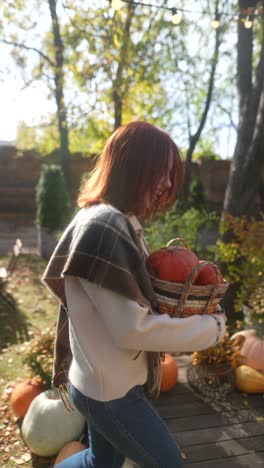 woman with pumpkins in a basket