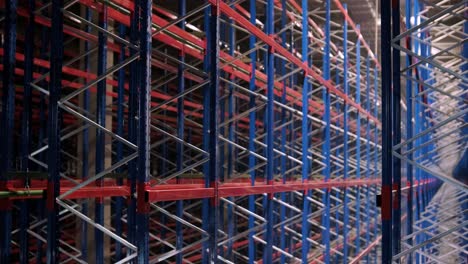 big and modern warehouse under construction, featuring metal shelving and other industrial equipment.