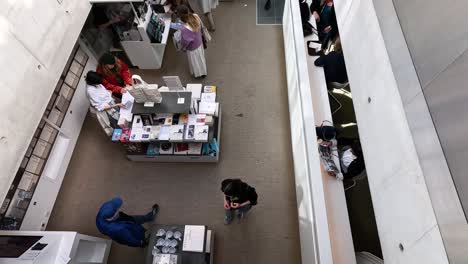 people browsing and walking in museum gift shop