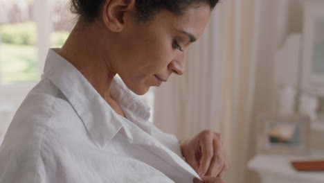 beautiful-woman-dressing-getting-ready-for-work-putting-on-clothes-smiling-looking-in-mirror-enjoying-fresh-new-day-feeling-positive-4k-footage