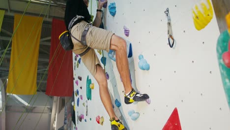 man rock climbing indoor