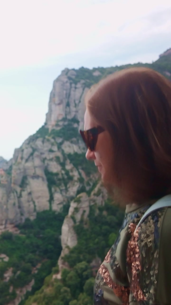 Woman admiring Montserrat mountain panoramic view