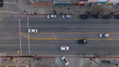 aerial footage of cars moving along busy street, ventura boulevard traffic in daytime