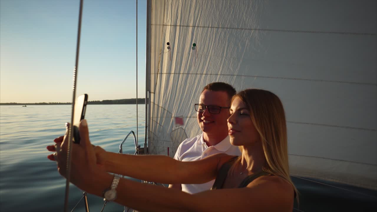Couple Taking Selfie on a Yacht at Sunset