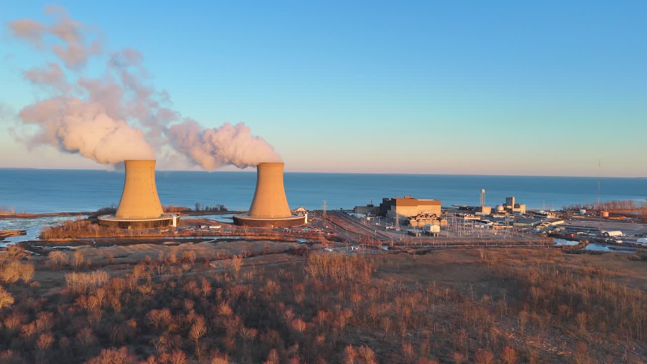 Wide aerial of Enrico Fermi II Nuclear Plant at dawn on Lake Erie coastline, Berlin Township, Michigan, USA