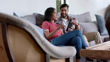 Young-Asian-couple-enjoys-a-relaxed-moment-on-the-couch-at-home