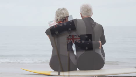 sitting on surfboard by ocean, elderly couple with australian flag animation