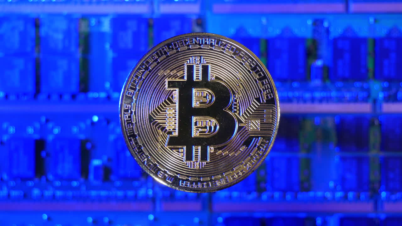 A Bitcoin BTC crypto currency coin hovering over a mining rig of computer chips and electric energy passing through
