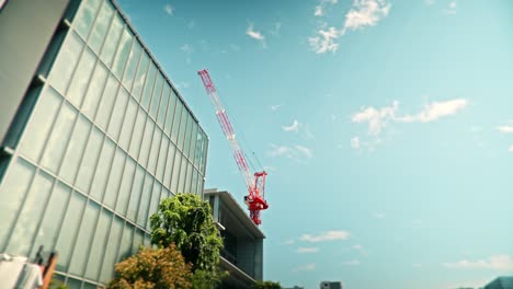 modern building under construction with crane