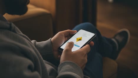 user interacting with mobile application on smartphone, engaging with digital content displayed on screen in a cozy indoor environment during evening hours