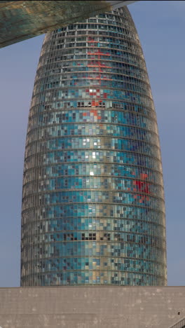 timelapse of the encants second hand market in barcelona and skyline behind in vertical