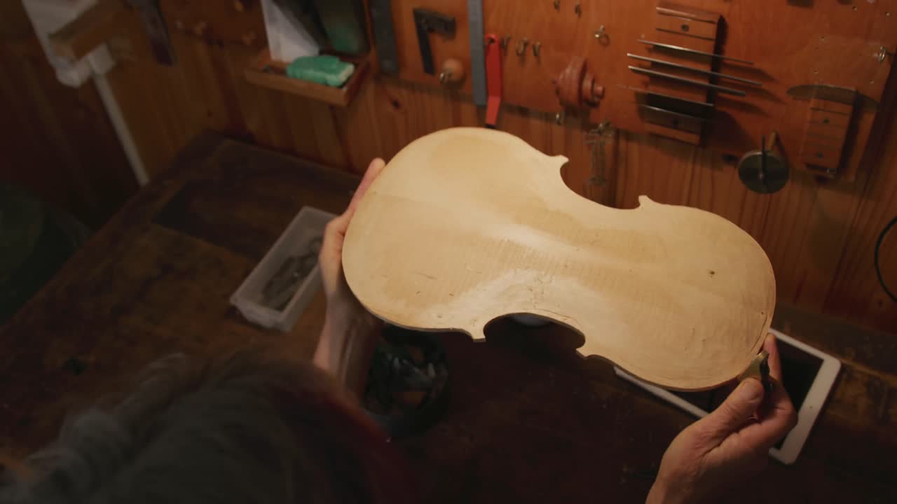Female luthier at work in her workshop