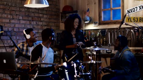 young musicians rehearsing in garage