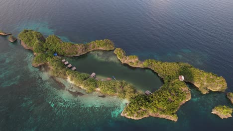 Beautiful-shot-of-a-tropical-island-with-lake-in-the-middle-in-Raja-Ampat-Indonesia