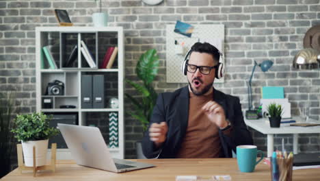 Man Dancing to Music in the Office
