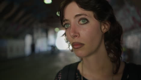 Anxious-Young-Alternative-Style-Woman-Walking-Along-Dark-Underpass-With-Graffiti-Covered-Walls-On-London-City-Street-UK-In-Real-Time-3