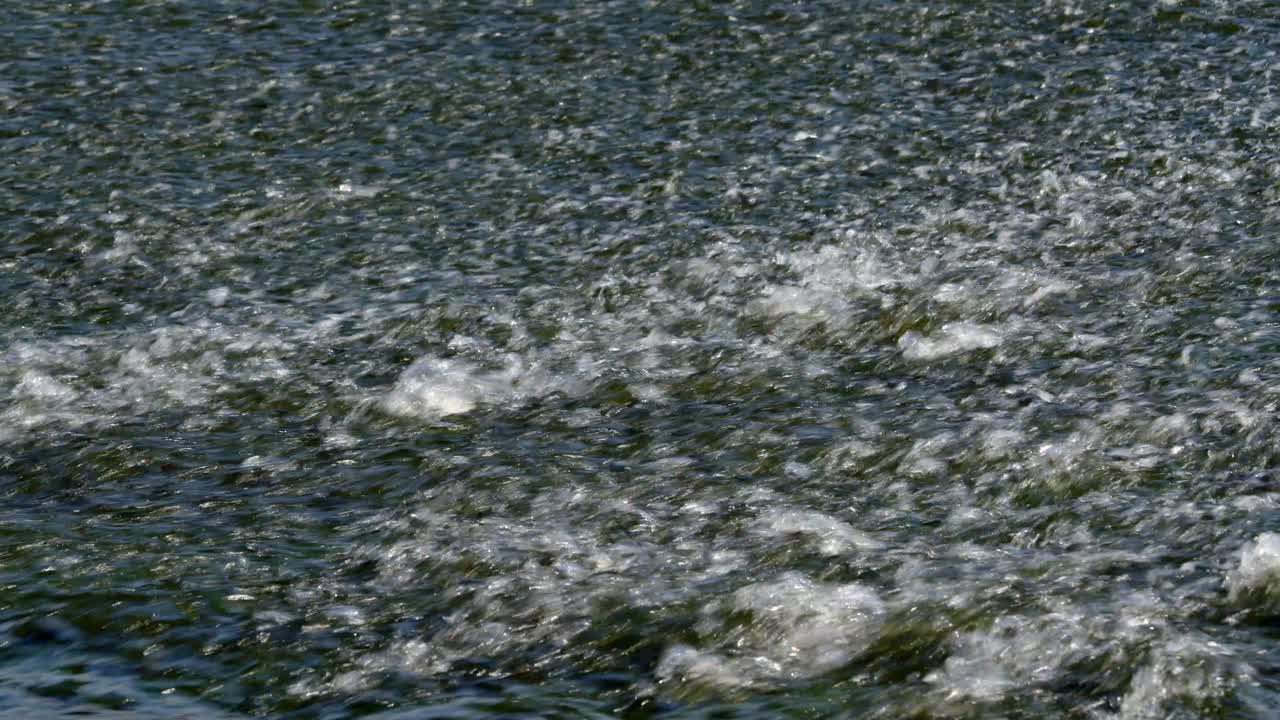 mid shot of water going over the River Trent weir by By Ratcliffe on Soar Power station