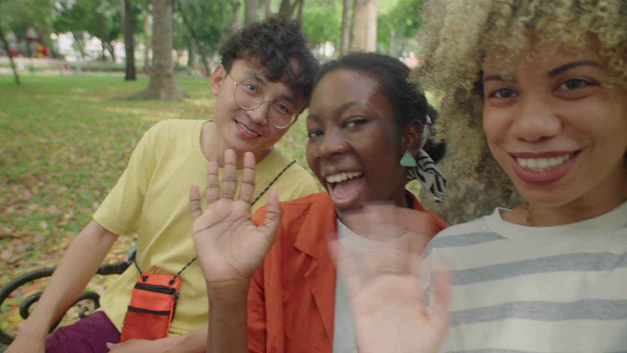 College Friends Video Calling in Park