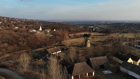 Aerial-View-Of-A-Small-Village-with-a-Windmill-in-HUNGARIAN-OPEN-AIR-MUSEUM