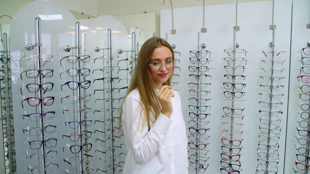 Woman in optics store. Happy woman choosing glasses at optics store