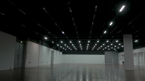 cinematic gimble shot of empty hall with lights turning on