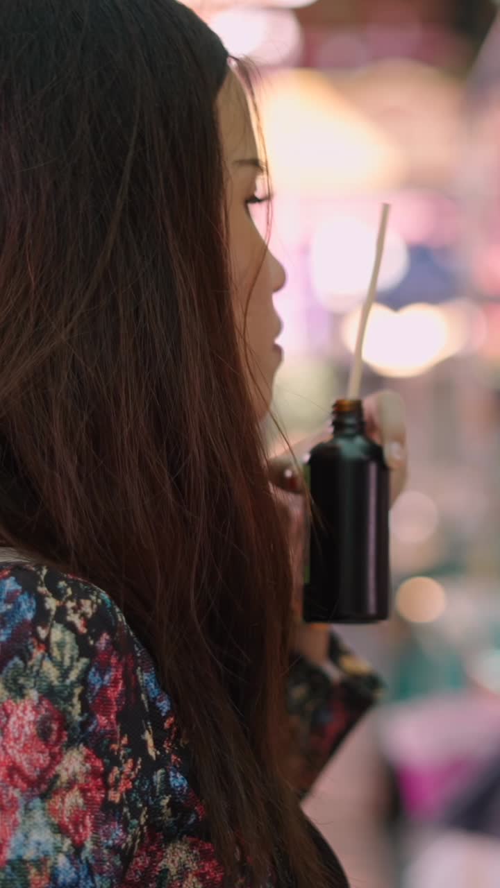 Woman holding a bottle