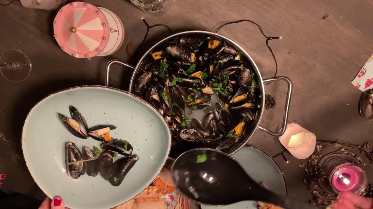 Top view of group of people serving fresh Mussels
