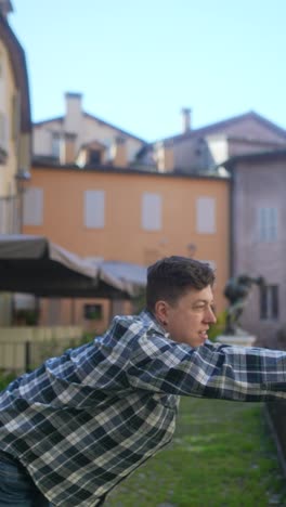 man stretching outdoors in a city