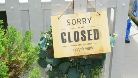 sorry we are closed the signboard hanging on the door of the cafe