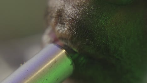 extreme close-up of lips exhaling smoke in slow motion with metallic lighting and cinematic detail.