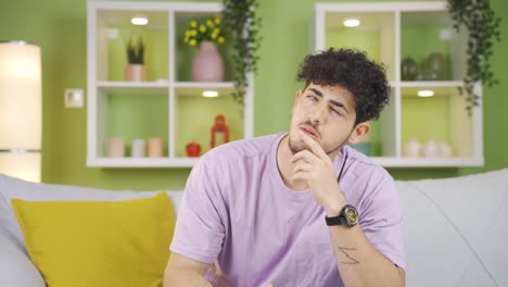 Thoughtful-young-man-doing-calculations-in-his-head-and-coming-up-with-an-idea.