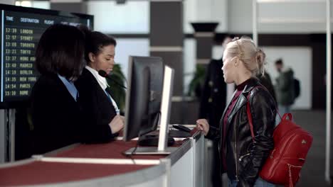 airport security personnel processing passengers